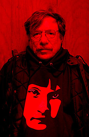 Dennis Webb wearing Teesha Moore's mermaid sweatshirt in Prude Ranch Bunkhouse about 3:00 AM, photo by Jeff Rowe